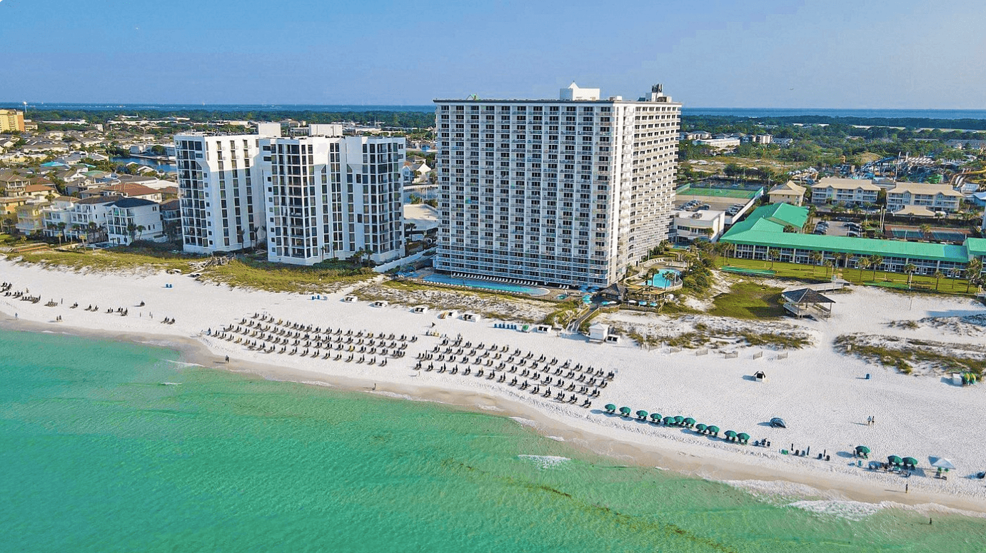 Aerial view of Pelican Beach Resort and its main Gulf-front condominium tower