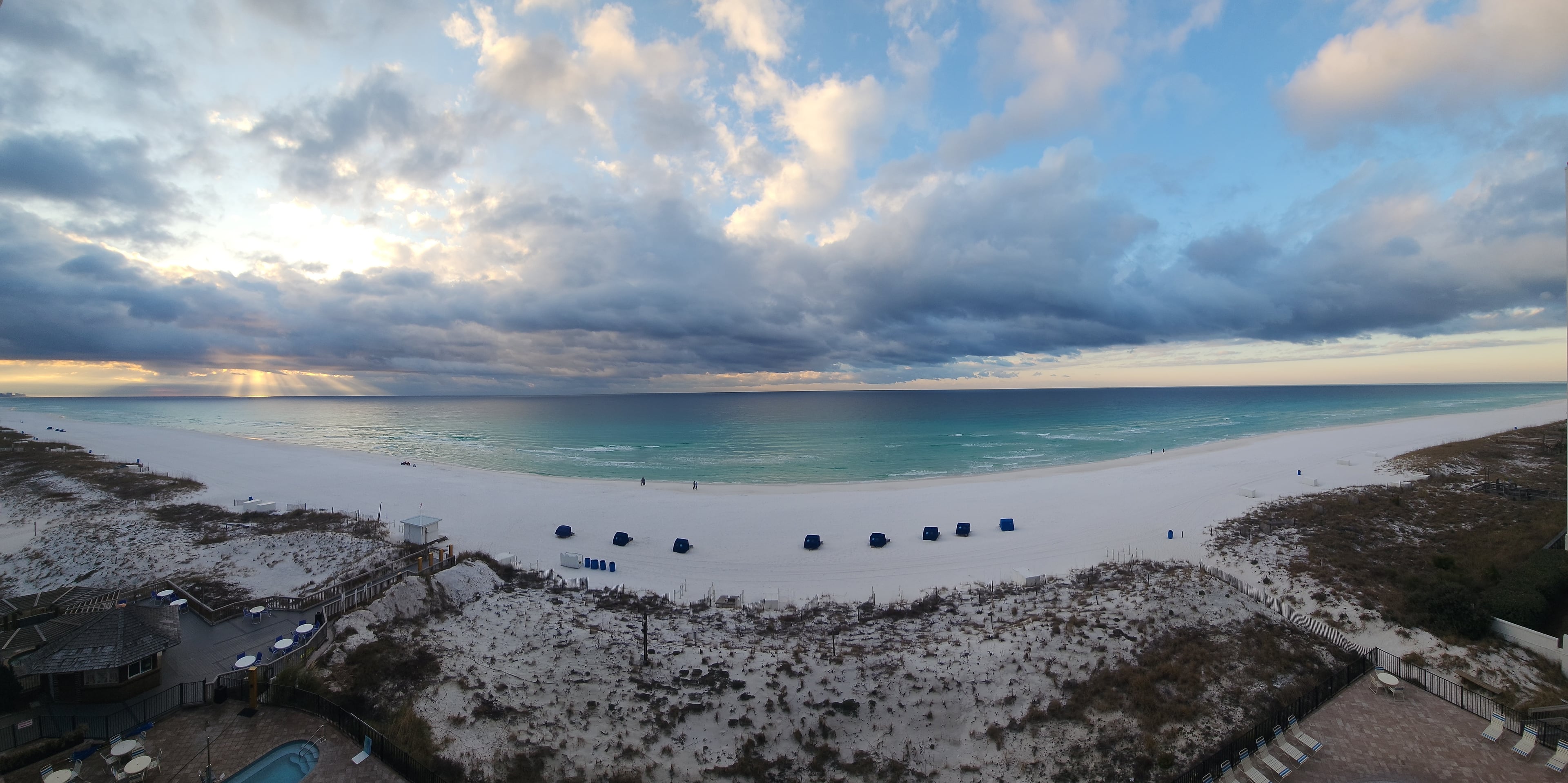 Dramatic clouds and sun rays over the Gulf at Pelican Beach Resort