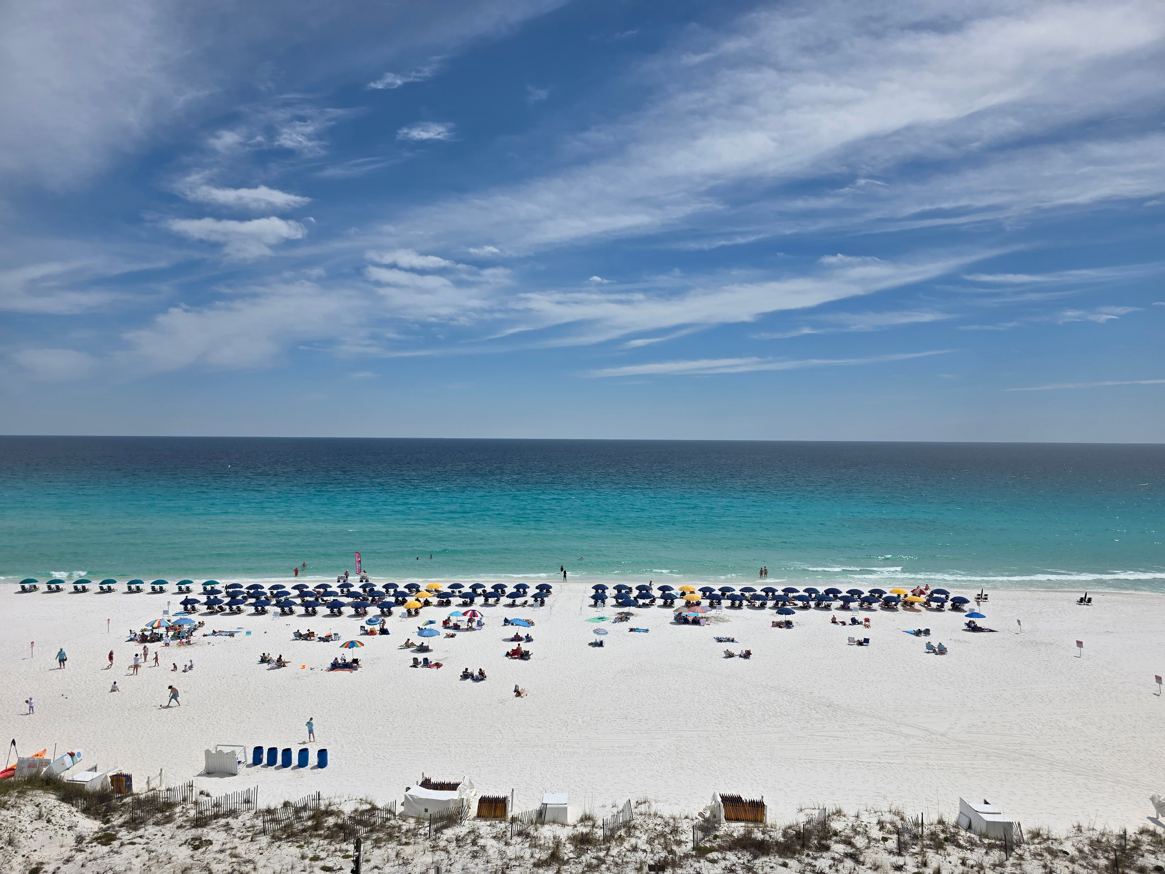 Emerald Gulf water and white-sand beach viewed from Pelican Beach Resort