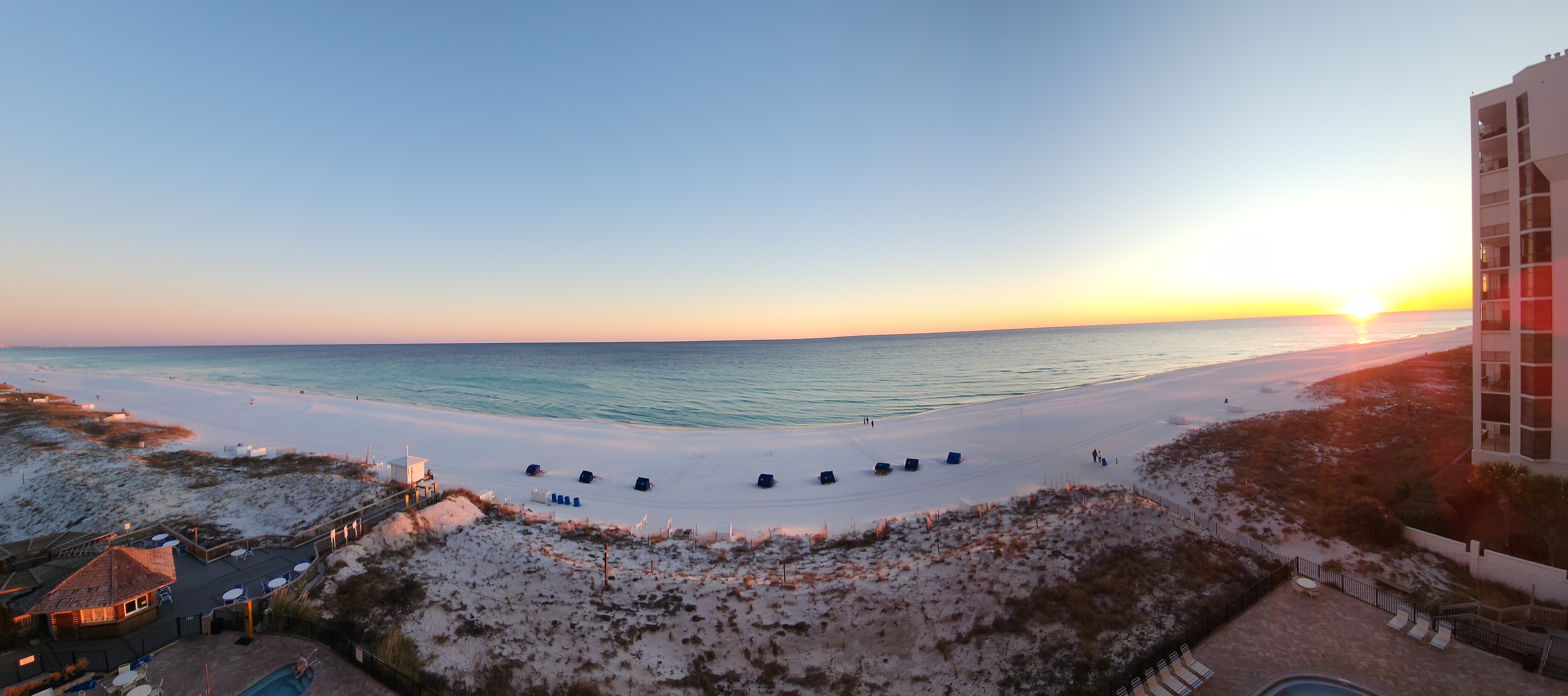 Sunrise over the beach viewed from Pelican Beach Resort in Destin