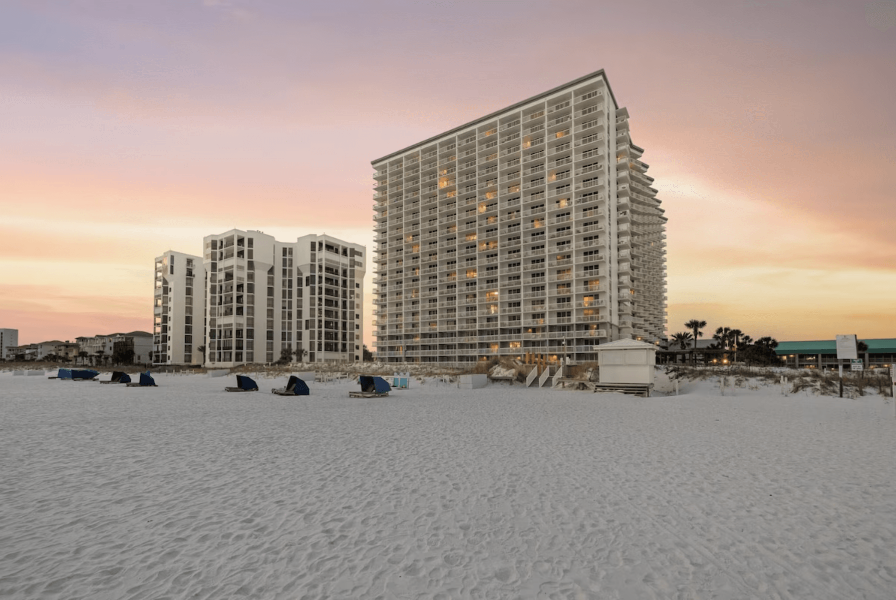 Pelican Beach Resort beachfront building at sunset in Destin