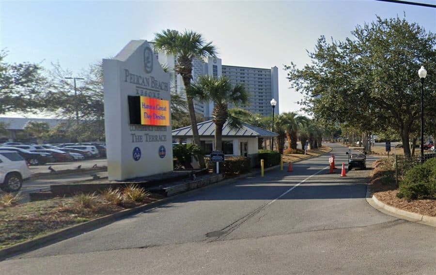 Security entrance and approach road at Pelican Beach Resort