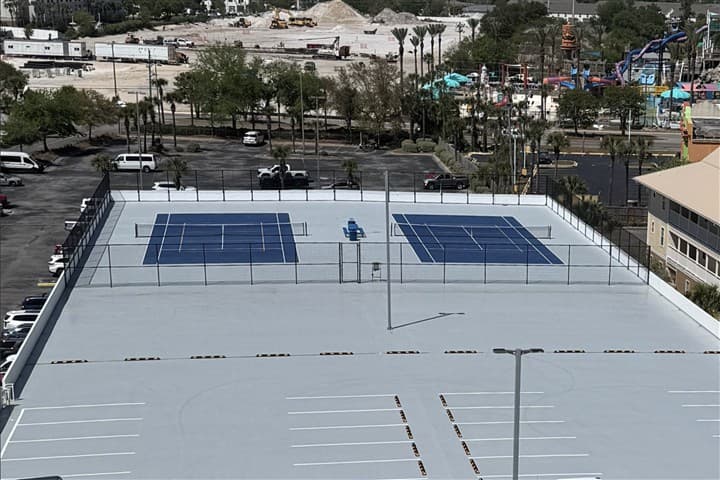 Tennis and pickleball courts above the Pelican Beach parking garage